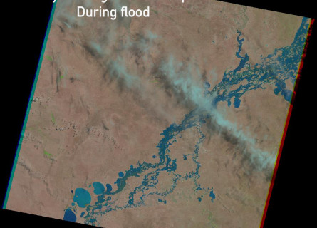 Satellite image showing the bright blue river with flooded area around it in the middle of a brown landscape. The words Murray-Darling Basin Floodplain During flood are superimposed over the image.