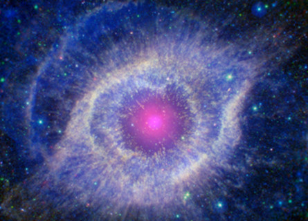 A nebula captured by NASA telescopes, showing a pink centre with expanding purple rings and hazy stars in the background.