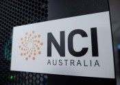 NCI logo on a black cabinet, with some flashing lights showing through behind it.