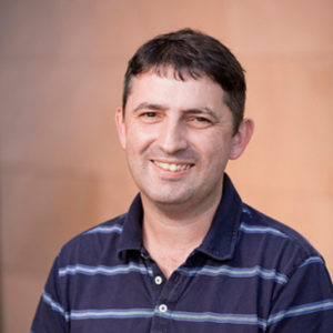 Headshot of man smiling at the camera.