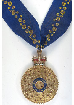 The gold medal and blue ribbon given to Companions of the Order of Australia.