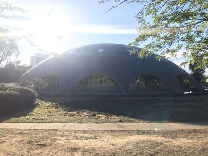 The Shine Dome in Canberra with a bright sun shining towards the camera.