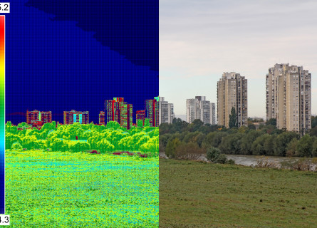 An image of buildings behind a field, with half of it superimposed with an infrared view of the temperature of each object.