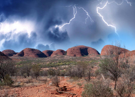 Bolts of lightning over the red rocks of Kata Tjuta in the Central Australian desert.