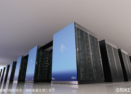 View of the Fugaku supercomputer showing its pale blue front panels and long dark rows of servers.