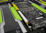 Close-up view of tiny transistors and chips alongside the green edges of GPU systems.