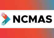 Logo of NCMAS, with the letters in the center in black and a red and blue chevron pointing to the letters on the left. A background gradient in the same pink, red, orange and blue colours of the chevron sits behind the logo.