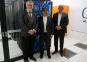 Delegates standing in front of the Gadi supercomputer