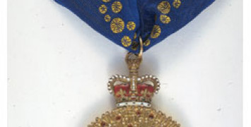 The gold medal with blue ribbon given to Companions of the Order of Australia.