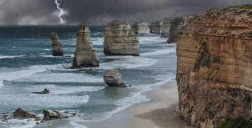 The rock stacks of the Twelve Apostles on the Australian coast in a heavy rain storm.
